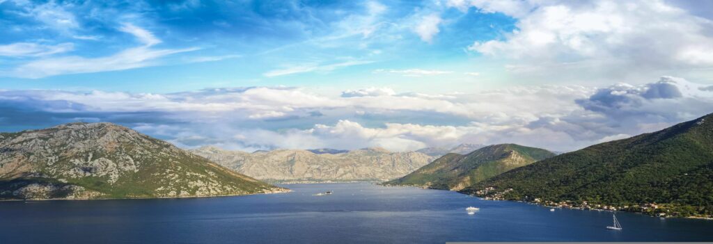 an expanse of body of water - a bay with a mountainous backdrop