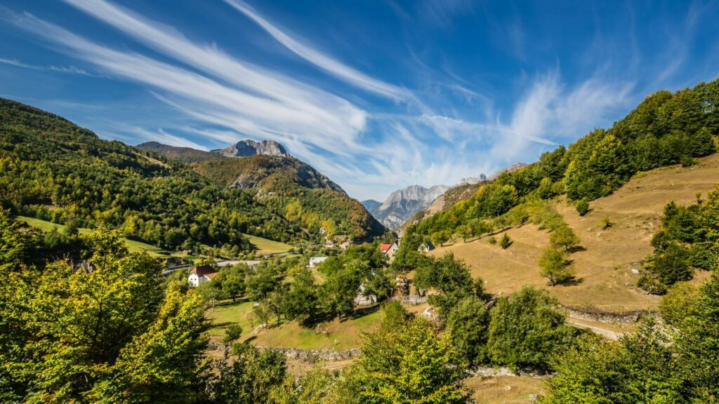 A valley with trees covering parts of it in the middle