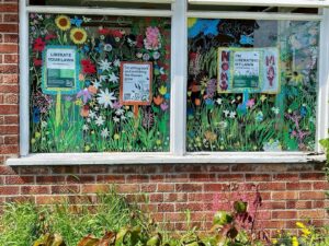 No Mow May school window display