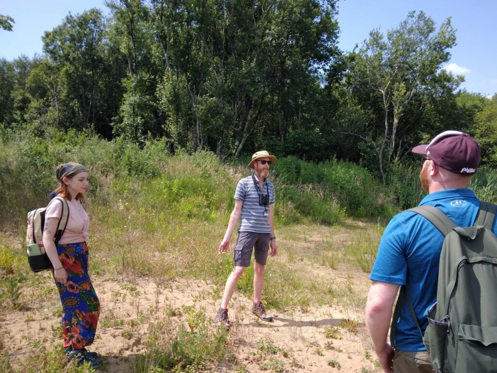 A group of volunteers take part in a citizen science session on the dunes