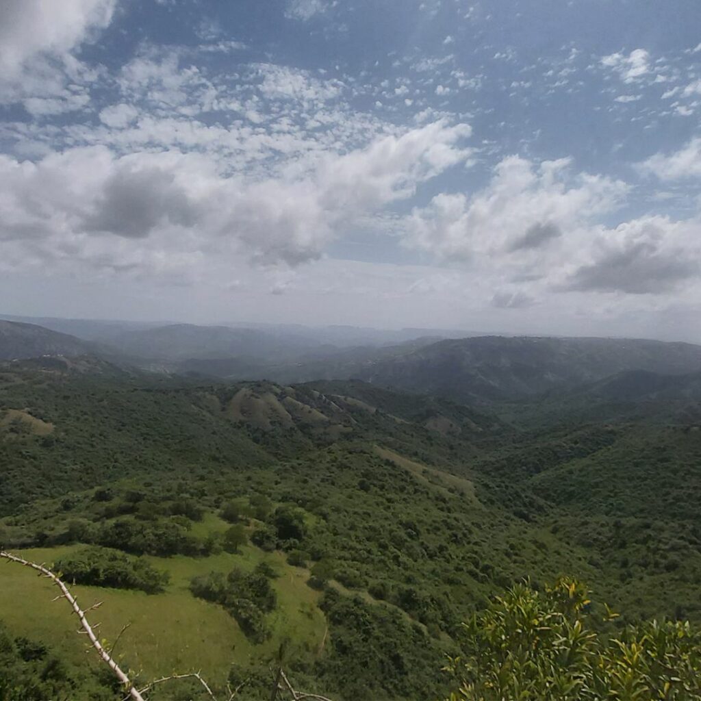 View across mountainous landscape with blue sky