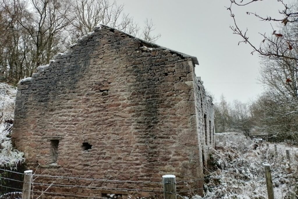 Snow settles on the old smelt mill at Augill Pasture
