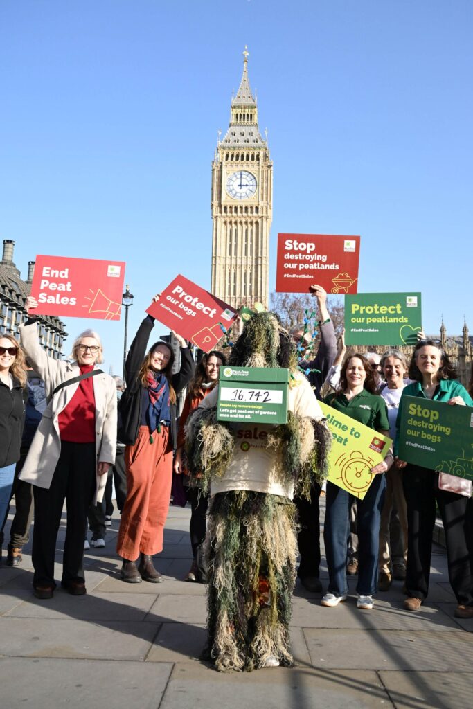 Campaigners outside Parliament with placards
