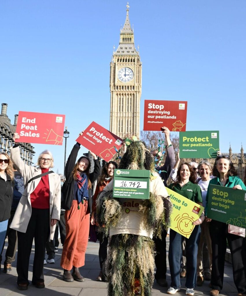 People holding placards calling for an end to peat sales